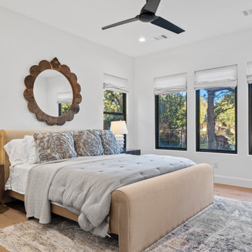 Modern Lakeside Farmhouse Second Master Bedroom with Upholstered Bed and Large W