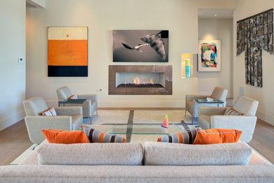 Large trendy formal and open concept medium tone wood floor, beige floor and exposed beam living room photo in Phoenix with beige walls, a ribbon fireplace, a metal fireplace and a wall-mounted tv