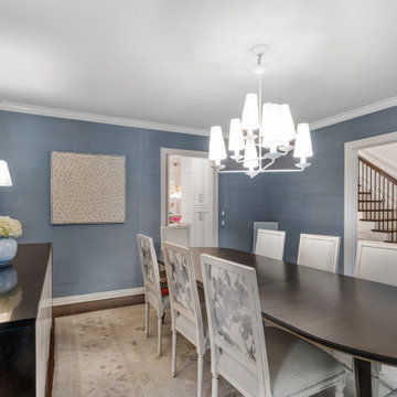 Elegant Formal Dining Room with Modern Chandelier and Subtle Blue Accents