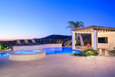 Design ideas for a large contemporary backyard stone landscaping in San Diego.