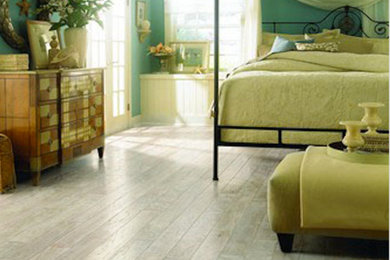 Large beach style master light wood floor and beige floor bedroom photo in Phoenix with blue walls and no fireplace