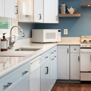 Light Blue and White Two-Toned Kitchen with White and Gray Quartz Countertop