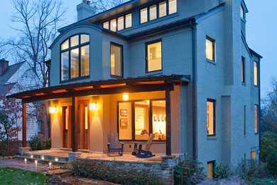 Transitional two-storey white exterior in DC Metro with wood siding.