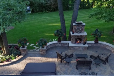 Traditional patio in Minneapolis with with fireplace.