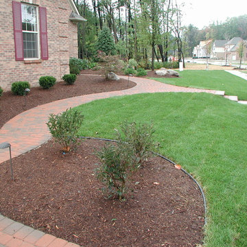 Front yard landscaping with back yard patio and pond