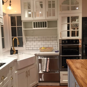 White hardwood kitchen cabinet with mirror grated doors