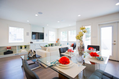 Inspiration for a mid-sized modern medium tone wood floor kitchen/dining room combo remodel in Vancouver with white walls and no fireplace
