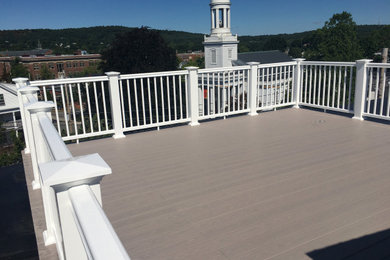 Example of a large classic rooftop rooftop mixed material railing deck design in Boston
