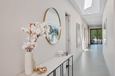 Inspiration for a contemporary hallway in Sydney with white walls.