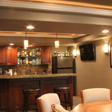 Eye-popping Denver Basement Remodel with hidden bookcase doors and tray ceilings