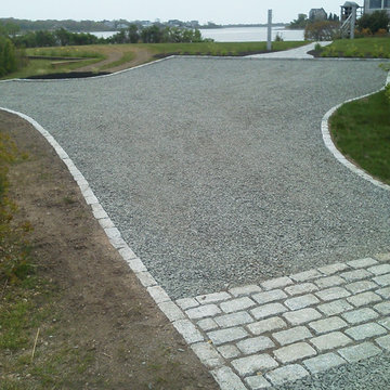 Gravel drive with cobblestone border and apron