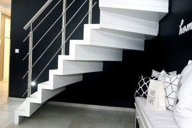 Design ideas for a modern metal railing staircase in Other.