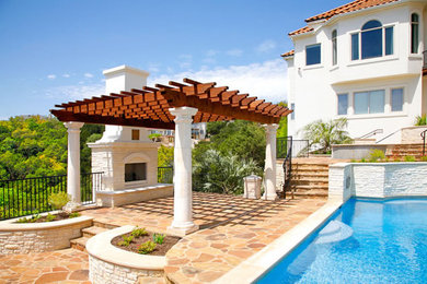 Mid-sized minimalist backyard stone and custom-shaped pool photo in Austin