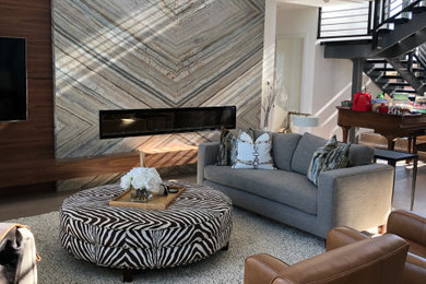 Example of a huge trendy open concept family room design in Las Vegas with white walls, a stone fireplace and a wall-mounted tv