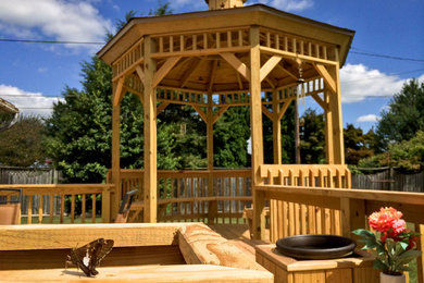 Example of a mid-sized arts and crafts backyard deck design in Philadelphia
