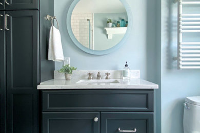 Inspiration for a timeless master white tile and subway tile porcelain tile, white floor and single-sink claw-foot bathtub remodel in Boston with raised-panel cabinets, gray cabinets, a two-piece toilet, blue walls, an undermount sink, quartz countertops, a hinged shower door and a built-in vanity
