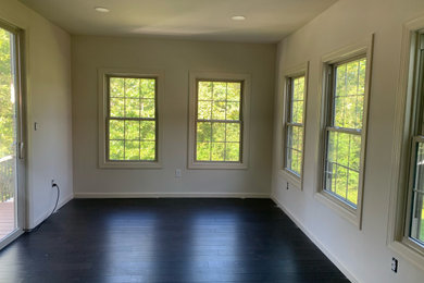 Sunroom - dark wood floor sunroom idea in DC Metro