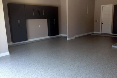 Example of a mid-sized trendy attached garage design in Austin