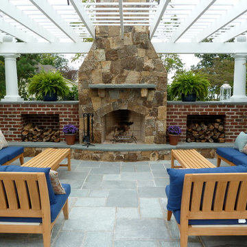 Western Maryland Stone Fireplace with Flagstone Accents and Brick Storage Areas