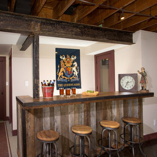 Design ideas for a medium sized rustic look-out basement in DC Metro with white walls.