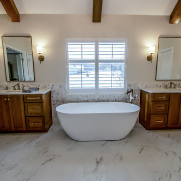 Luxury Spa Bathroom with Natural Warm Vanities, Quartz Countertop, Tiled Shower