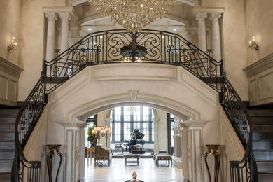 Elegant beige floor foyer photo in St Louis with beige walls