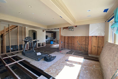 Example of a mid-sized trendy open concept coffered ceiling game room design in Denver