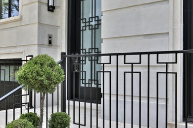 Transitional limestone floor single front door photo in Toronto with white walls and a glass front door