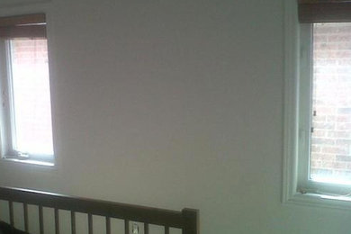 Mid-sized guest bedroom photo in Toronto with white walls