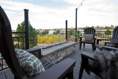 Mid-sized trendy backyard second story metal railing deck photo in Denver with a fire pit and no cover