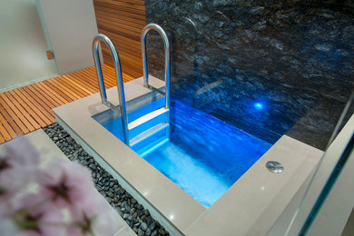 Inspiration for a modern indoor tile and rectangular hot tub remodel in Vancouver