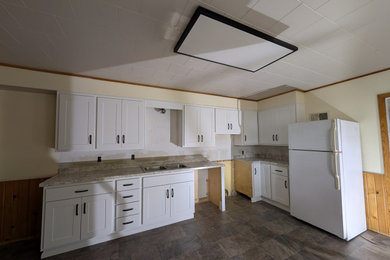 Inspiration for a mid-sized transitional l-shaped enclosed kitchen remodel in Other with shaker cabinets, white cabinets and laminate countertops