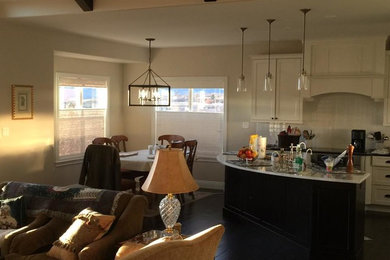 Example of a mid-sized trendy l-shaped dark wood floor open concept kitchen design in Denver with beaded inset cabinets, white cabinets, white backsplash, subway tile backsplash and a peninsula