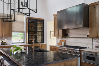 Example of a kitchen design in Austin with stone slab backsplash