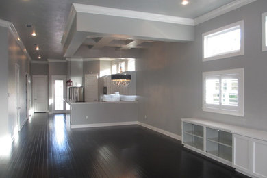 Example of a mid-sized zen open concept living room design in Miami with gray walls and a wall-mounted tv