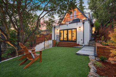 This is an example of a mid-sized transitional drought-tolerant and partial sun front yard concrete paver and wood fence landscaping in San Francisco for fall.