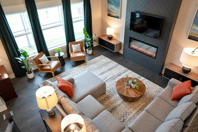 Living room - large mid-century modern open concept laminate floor and brown floor living room idea in Nashville with beige walls, a standard fireplace and a shiplap fireplace