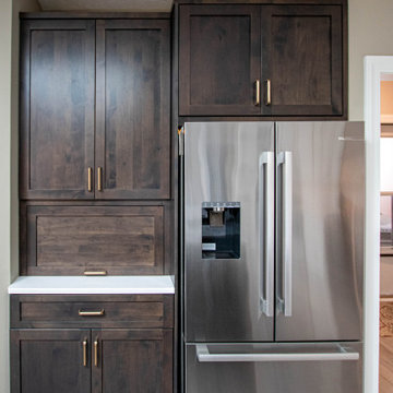 3 Finishes on Kitchen Cabinetry with Galley Workstation in Island and Wine Bar