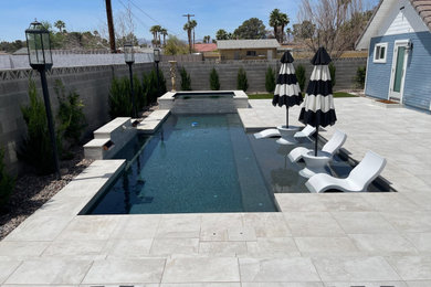 Pool - backyard custom-shaped pool idea in Las Vegas