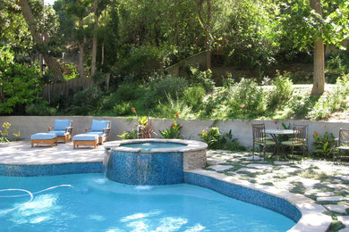 Tuscan custom-shaped pool photo in Los Angeles