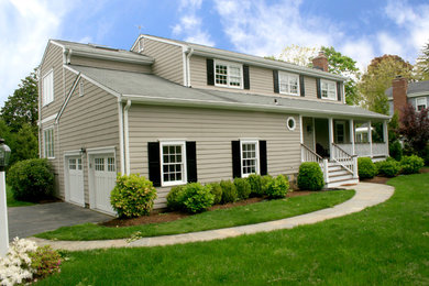 Photo of a mid-sized traditional two-storey brown house exterior in New York with wood siding, a gable roof and a shingle roof.