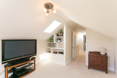 Inspiration for a craftsman carpeted family room remodel in Portland with beige walls