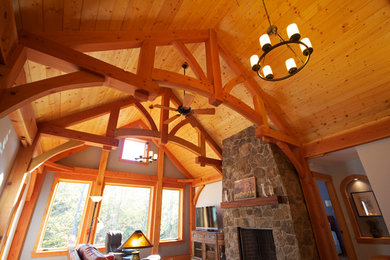 Inspiration for a mid-sized craftsman open concept living room remodel in Richmond with white walls, a standard fireplace and a stone fireplace
