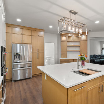 Spacious Kitchen Aisle and Workstation Island After Remodel