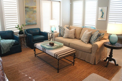 Example of a mid-sized beach style formal and enclosed living room design in Miami with gray walls and a wall-mounted tv