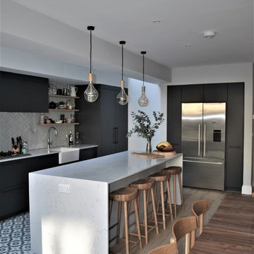 Modern dark grey kitchen with black handles