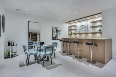 Mid-sized minimalist l-shaped wet bar photo in Vancouver with an undermount sink, quartz countertops and beige cabinets
