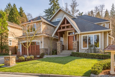 Example of a large classic brown three-story wood exterior home design in Seattle