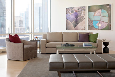 Photo of a mid-sized modern formal open concept living room in Chicago with light hardwood floors and white walls.