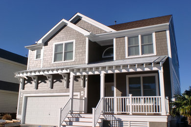 Example of a mid-sized beach style home design design in Other